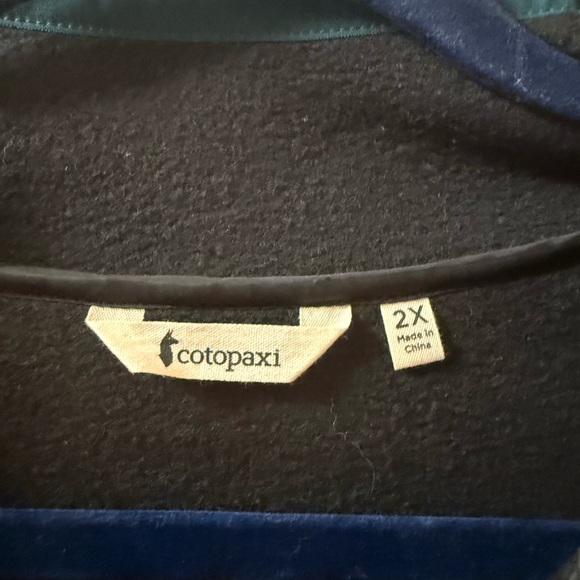 cotopaxi Black Fleece Pullover with Blue Chest Stripe and Red Snap Placket - Picture 3 of 3